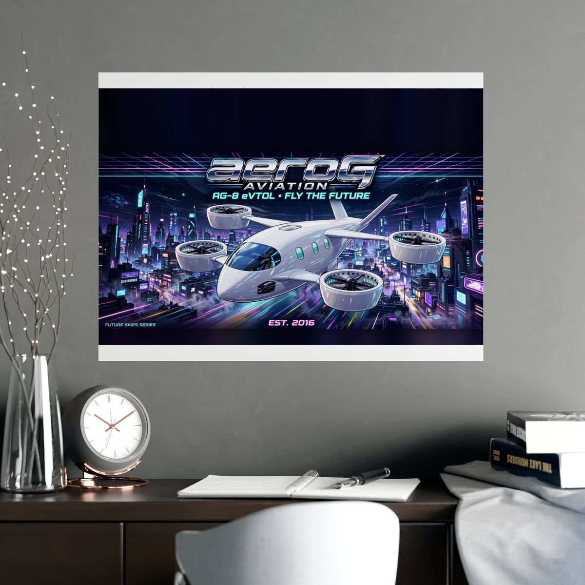 Neon City poster on a gray wall above a desk with a vase, clock, and books