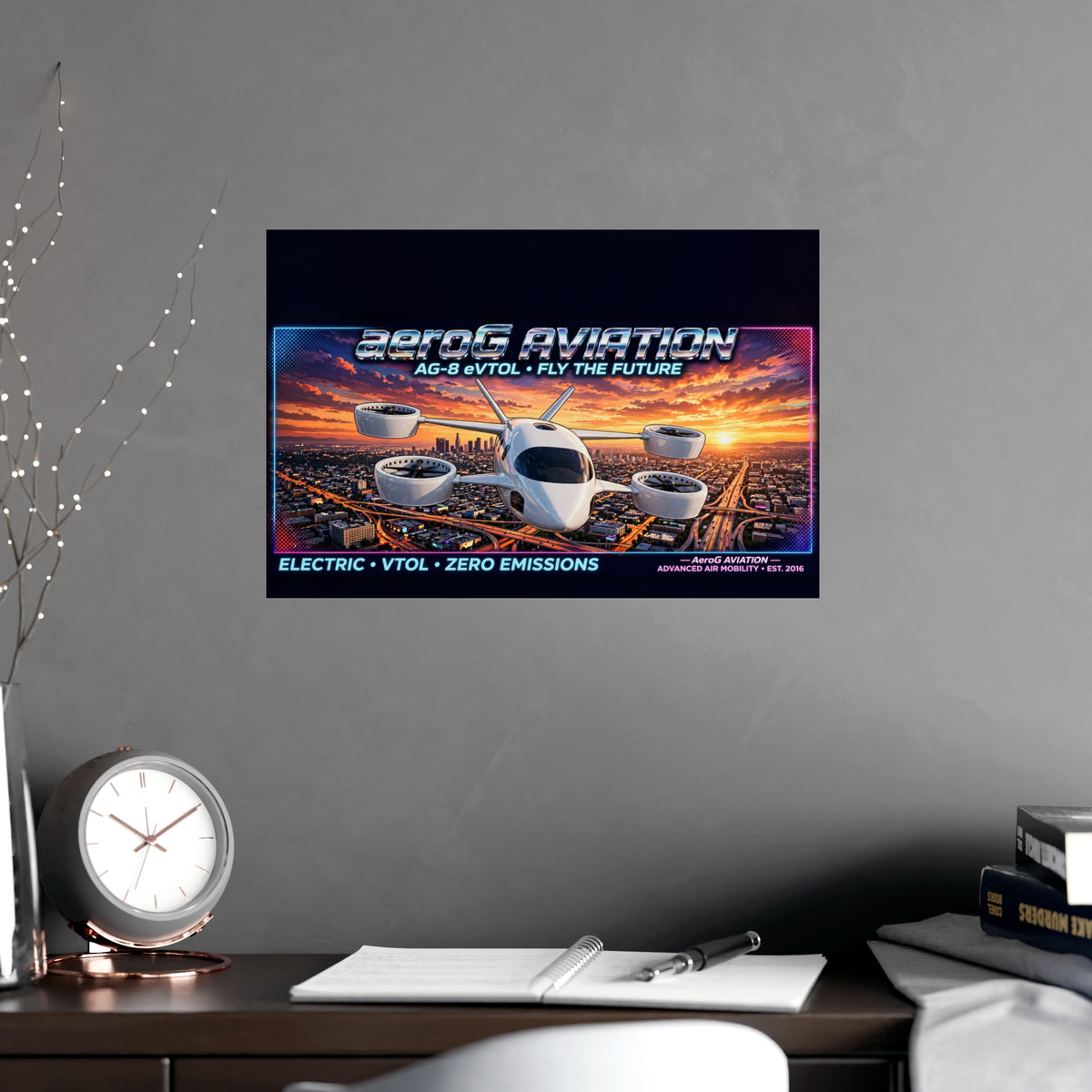 Arcade style aviation poster: LA Sunset — lifestyle mockup of the unframed poster on a gray wall above a wooden desk with a round clock, open notebook, pen, books, and decorative string lights, by aeroG Aviation