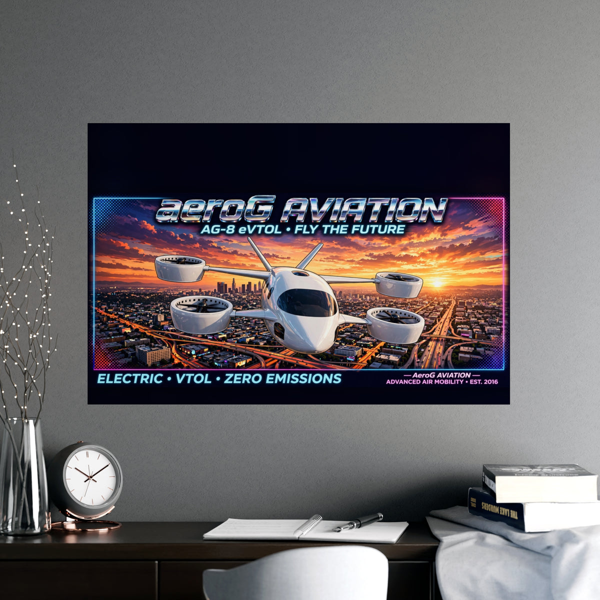 Arcade style aviation poster: LA Sunset — lifestyle mockup of the unframed poster on a gray wall above a wooden desk with a clock, notebook, pen, books, a vase of decorative branches, and a white chair, by aeroG Aviation