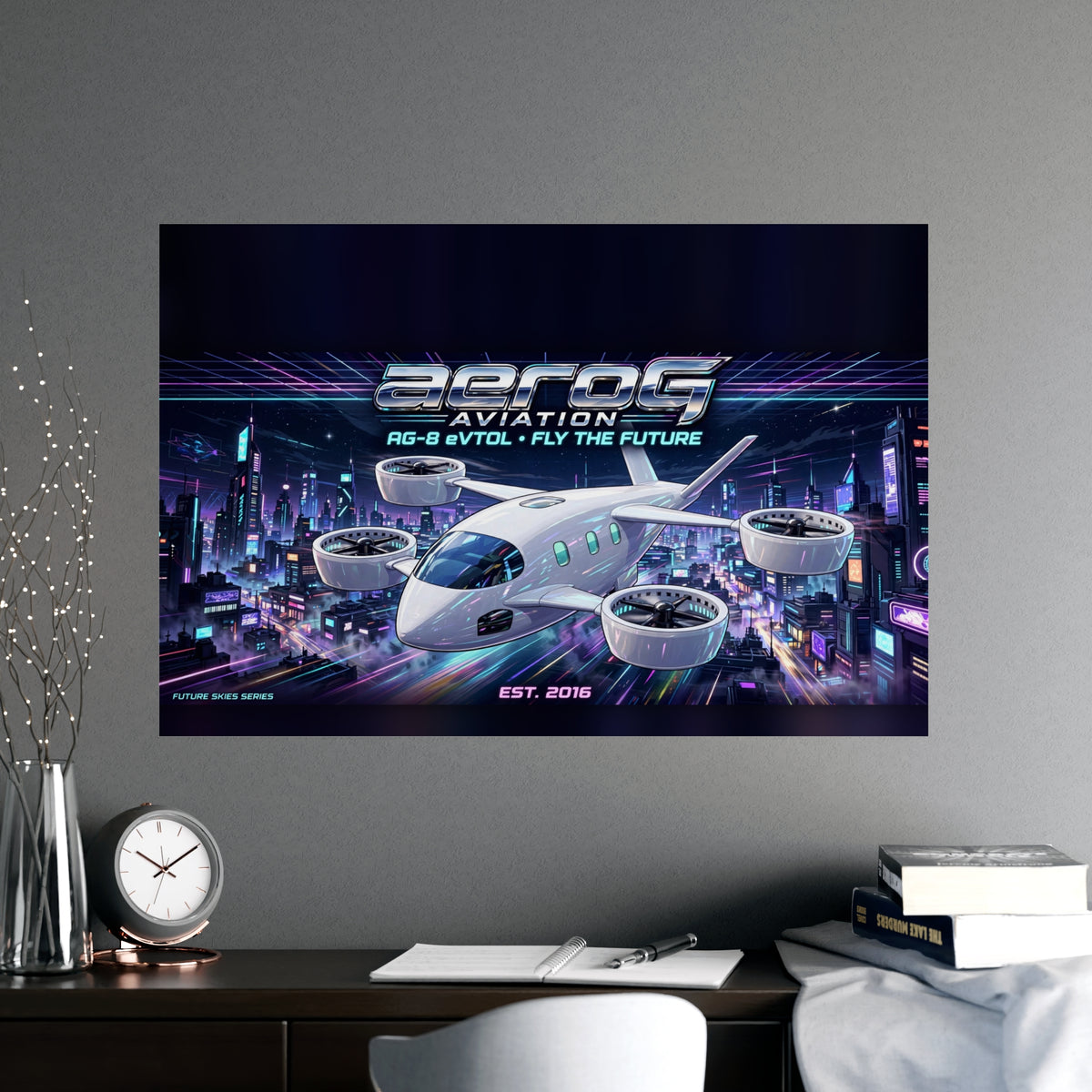 Neon City poster on a gray wall above a desk with books, a clock, and branches