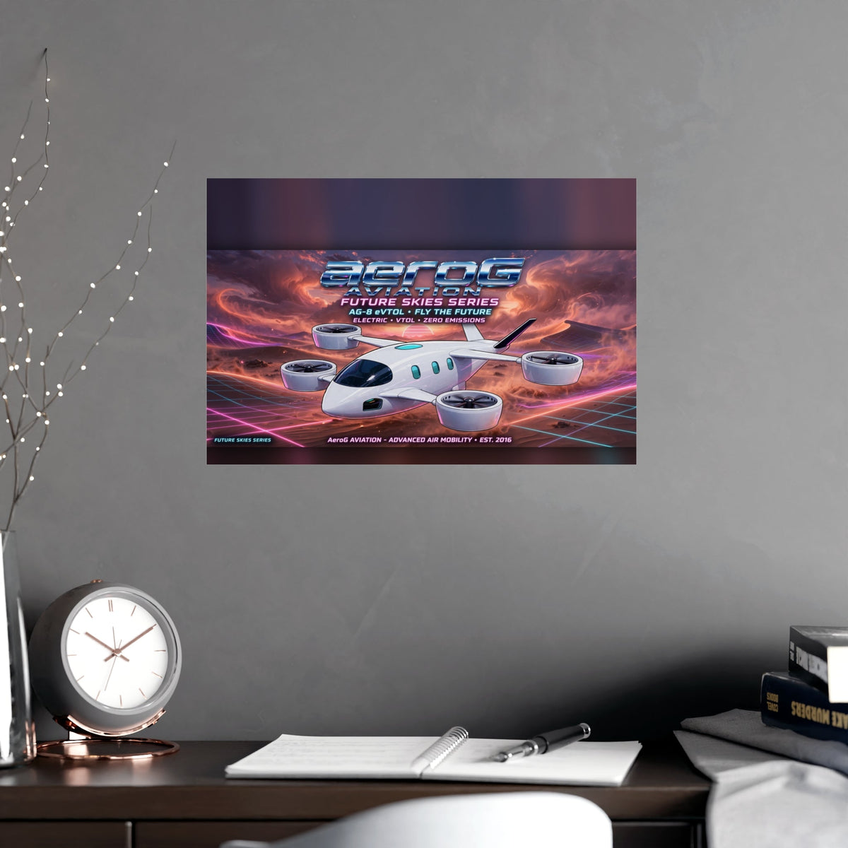 Arcade style aviation poster: Desert Storm — lifestyle mockup of the small unframed poster centered on a gray wall above a dark wooden desk with a round clock, open notebook, pen, books, tall decorative branches, and a white chair, by aeroG Aviation