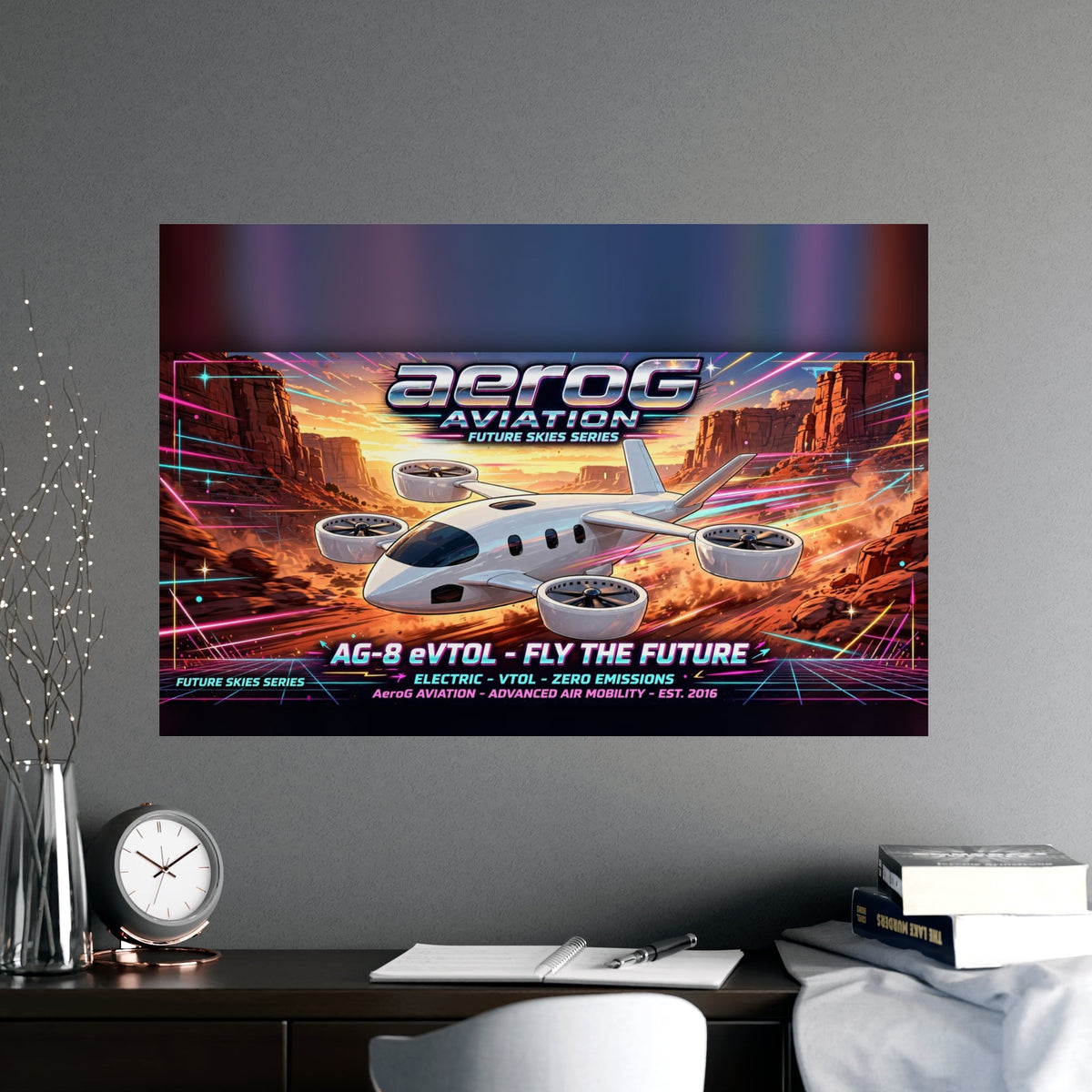 Arcade style aviation poster: Canyon Run — lifestyle mockup of the framed poster on a gray wall above a dark wooden desk with a clock, notebook, pen, books, and a vase of decorative branches, by aeroG Aviation